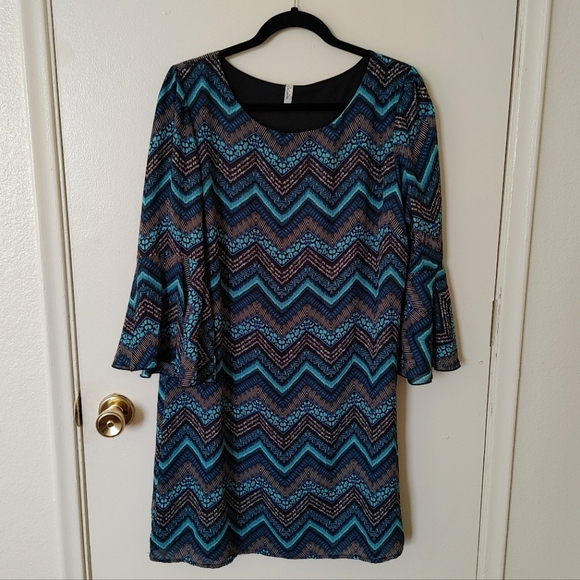 Celeste Dresses & Skirts - Celeste knee-length dress with blue/teal/black pattern and flowy sleeves